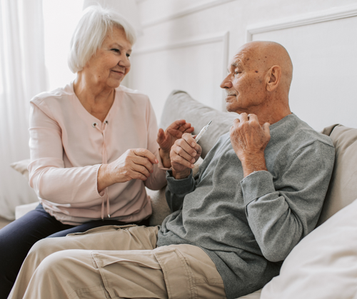 caregiver assisting a senior with medication